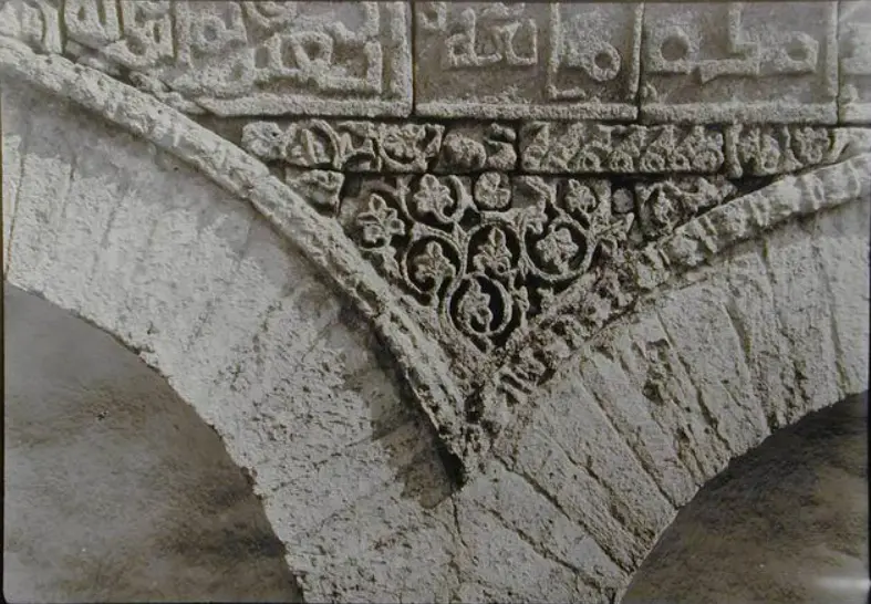 Detailed view of the Kufic inscriptions on the Mosque of Three Doors in Kairouan