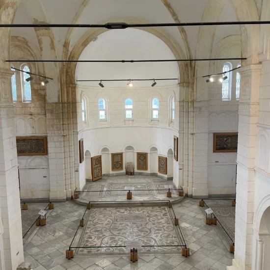 Inside view of the Archaeological Museum of Enfidha showing arches and stone walls of the former Saint Augustine Church, now housing ancient artifacts