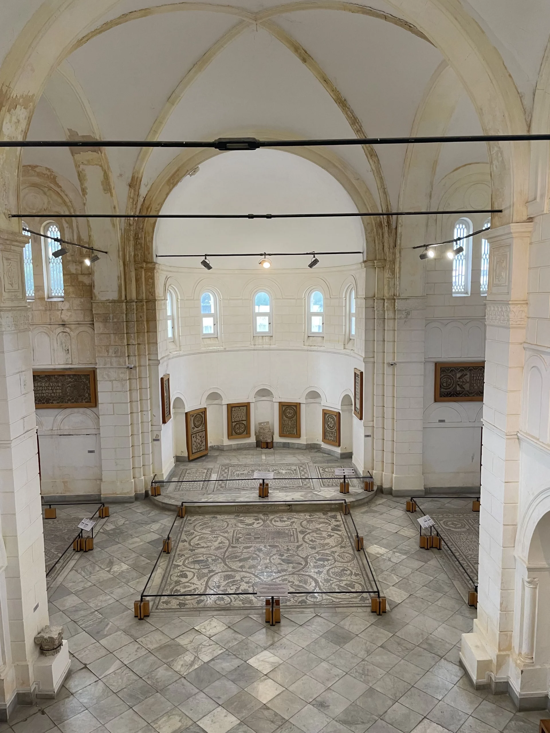 Inside view of the Archaeological Museum of Enfidha showing arches and stone walls of the former Saint Augustine Church, now housing ancient artifacts